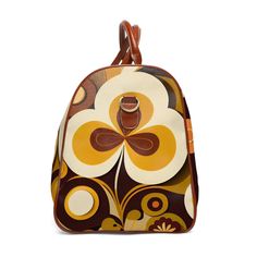 Jet set in retro style with this 60s-70s inspired geometric duffel bag. Featuring bold abstract floral prints in mod colors, this groovy weekender carry-on pops with psychedelic flower power. The durable construction and leather accents make this 20" × 12'' × 9" bag ideal for road trips or overnight getaways. With its vibrant old school vibe, this hip weekend bag turns heads while keeping your essentials organized. Travel back to the age of peace and free love with this funky modular duffel! One Retro Brown Bags With Zipper Closure, Retro Rectangular Bag With Zipper Closure, Retro Travel Bag With Zipper Closure, Brown Travel Bags, Retro Yellow Satchel Bag, Retro Multicolor Large Capacity Bag, Retro Multicolor Bag With Large Capacity, Vintage Multicolor Bag With Zipper Closure, Retro Yellow Travel Bag