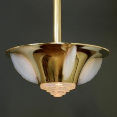 This round Art Deco Lüster probably from the house of Jean Perzel, Paris, it consists of polished brass and 4 vertical opalescent ornamental glasses on the luminaire screen, which create a very interesting light. Another opalescent ornament glass closes to the canopy. All glasses undamaged! A very rare original from the 1930s. New electrified! This piece is designed in the style of the selected designer and/or manufacturer, Up to 250V (Europe/UK Standard).The wiring of this item may be original Art Deco Ceiling, Green Pendants, Round Art, Glass Pendant Light, Chandeliers And Pendants, Light Art, Polished Brass, Chrome Finish, Glass Pendants