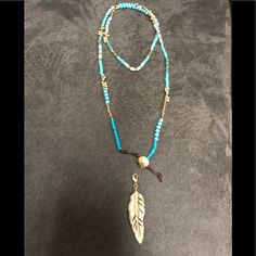 Turquoise Beads, Semi-Matte Gold Plating, Detachable Feather Charm Included. Double It Up With The Charm Or Wear It Long Without The Charm. Never Worn Adjustable Blue Lariat Necklace, Blue Adjustable Lariat Necklace, Adjustable Turquoise Beaded Chain Necklace, Adjustable Multi-strand Turquoise Blue Necklace, Adjustable Beaded Turquoise Necklace, Beaded Blue Turquoise Lariat Necklace, Blue Beaded Turquoise Lariat Necklace, Blue Beaded Lariat Turquoise Necklace, Adjustable Beaded Long Turquoise Necklace