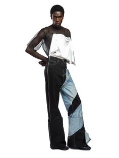 Fruché's jeans are aptly named Spiral, thanks to the contrasting denim wrapped around one leg. Crafted from soft cotton in Lagos, they sit high on the waist and fall to a generous flared leg with deep turn-ups. The 5-pocket construction is a classic silhouette, so you know they offer a comfortable fit. Style yours with the Dazed Shirt to channel the label's boundary-pushing aesthetic.- 5 pockets, side zip, wide leg- Cotton- Artisanally crafted by female communities in the Delta State- Each piece Spiral Jeans, Cutout Pants, Fashion Design Studio, Osei Duro, African Luxury, Fashion Designer Studio, Hair Cuffs, Jeans Uk, Red Carpet Ready