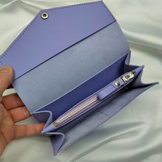 This long leather wallet is completely handmade, this wallet can be used as a wallet or as a mini clutch for daily walks. Each wallet comes with a small key holder with an original design and a leather keychain as a gift. This set will be packed in a craft box with filling, which will save you time for gift wrapping A high-quality, stylish gift for your mother, wife, friend, sister, or just a girl you know. The wallet is made in the shape of an envelope, which gives it an elegant appearance and Purple Leather Wallet As Gift, Purple Leather Wallet For Gift, Purple Leather Wallet As A Gift, Purple Leather Wallets For Gifts, Purple Leather Rectangular Wallet, Purple Rectangular Wallet With Interior Card Slots, Purple Wallets With Removable Pouch For Everyday Use, Purple Clutch Wallet For Everyday, Purple Wallet With Interior Card Slots Gift