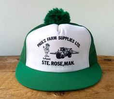 Out of Ste. Rose, Manitoba, comes this original vintage 80's trucker hat for PAUL'Z FARM SUPPLIES LTD. promoting "Simplot Canada" Agricultural Products - This polyester hat has a short but wide brim, unique graphics, rear nylon mesh, and an adjustable snapback closure. It was even topped off with a fluffy pom!  A true tough looking rural farmer hat! Condition: Great vintage stored shape - looks lightly or never worn Adult adjustable (fits most sizes between 6 7/8 - 7 5/8) Made in Korea by Yupoon Vintage Green Flat Bill Hat, Cheap Vintage Green Trucker Hat, Green Adjustable Vintage Snapback Hat, Vintage 5-panel Baseball Cap For Outdoor, Vintage 5-panel Trucker Hat For Baseball Season, Vintage Farm, Snapback Cap, Vintage Store, Ball Cap