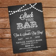 a chalkboard sign with lights on it that says stock the bar