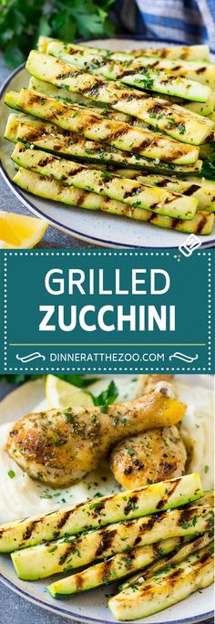 grilled zucchini on a plate with lemon wedges