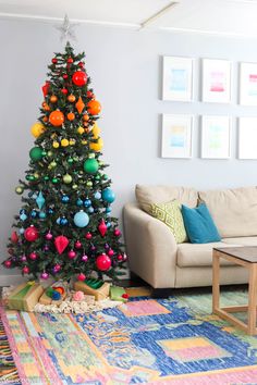 a brightly colored christmas tree in a living room