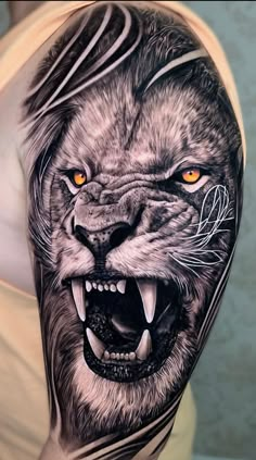 a man's arm with an animal tattoo on it, and the image of a lion