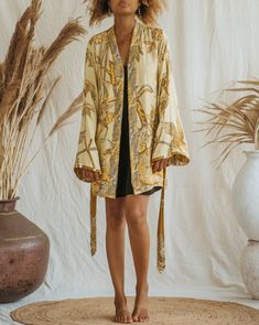 Presenting the Golden Lotus - Short Kimono, a unique piece from our slow fashion collection that's designed to radiate your confidence and individuality. This distinct piece is reversible, displaying meticulous craftsmanship and made-to-order for an opulent appearance that's sure to captivate attention. Size: Our model has the following measurements: Height: 172 cm | 5 ft 7 inches Chest: 88-94 cm | 35-37 inches She is wearing size M kimono with 85 cm | 33 inch length. Elegant Relaxed Fit Sleepwear For Spring, Chic Long Sleeve Kimono For Loungewear, Fall Kimono With Relaxed Fit For Loungewear, Chic Fall Kimono For Loungewear, Chic Fall Loungewear Kimono, Chic Flowy Kimono For Loungewear, Spring Daywear Kimono With Relaxed Fit, Spring Daywear Relaxed Fit Kimono, Elegant Long Sleeve Relaxed Fit Kimono