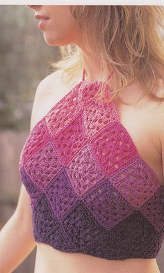 a woman wearing a pink and purple crochet top