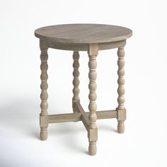 a small wooden table with two legs and a round top, on a white background