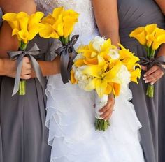 the bridesmaids are holding their bouquets with yellow flowers