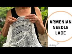 an old woman is holding a piece of crocheted lace with the words, armenin needle lace