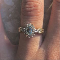 a woman's hand with a ring on it and an engagement band around her finger