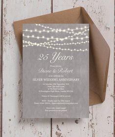 the 25 year anniversary party card is shown on top of an envelope with string lights