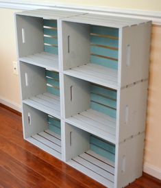 an empty shelf in the corner of a room with wooden floors and hard wood flooring