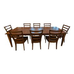 a large wooden table with six chairs and one chair that is missing the back end