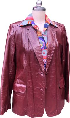 70's OXBLOOD LEATHER Jacket/Leather Jacket/70’s Red Rust Leather Jacket/70’s Jackets/70's Coats/70's Fashion/Near MINT Condition70's OXBLOOD LEATHER JacketYou’re Currently Viewing a Gorgeous Oxblood Color 70's Leather Jacket. This Jacket Features Two Large Outside Pockets and One Slide Pocket that is Inside. It Also Has Two Leather Covered Buttons on the Front and One on Each Sleeve. This Leather Jacket would make the Perfect Addition to Your Fall/Winter Wardrobe!!Measurements - Bust - 36" Shoulder width - 15. 5" Sleeve length - 24" Waist - 35" Hem width - 40" Measurements were taken with the Jacket buttoned. This would probably best fit a small. Near MINT Condition - This Jacket is qualified as Near MINT Condition. It looks as if it has never been worn or certainly very rarely. There is n Vintage Red Leather Outerwear, Retro Burgundy Long Sleeve Outerwear, Retro Fitted Leather Jacket, Fall Red Leather Blazer, Retro Single Breasted Leather Jacket With Long Sleeves, Retro Single-breasted Leather Jacket For Fall, Retro Single-breasted Leather Jacket With Long Sleeves, Retro Leather Blazer For Workwear, Red Leather Blazer For Fall