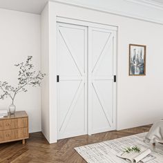 a bedroom with white walls and wooden flooring, two doors open to let in natural light