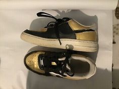 Girl’s Nike Air Force 1 Low GS Custom gold black 314192-117 - Size: 4.5Y.  Custom painted black and gold (with black hearts on back) good used condition. Nike Gold Sneakers For Streetwear, Nike Gold Casual Sneakers, Nike Casual Gold Sneakers, Casual Gold Nike Sneakers, Black Hearts, Nike Air Force 1 Low, Air Force 1 Low, Custom Painted, Custom Sneakers