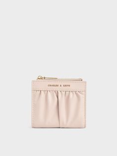 Contemporary and feminine, our Thea short wallet is the perfect gift for a loved one, or even as a treat to yourself. The petite size, along with the snap-button closure and zip compartment, tick all the boxes for functionality so you know your essentials are safe with you at all times. It also looks good while doing its job, thanks to the delightful light pink colour and ruched design. Slot it into your favourite mini bag, your back pocket or let it fly solo during coffee runs. Charles And Keith, Short Wallet, Light Pink Color, Pink Colour, Mini Wallet, Petite Size, Your Back