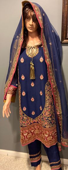 Mesmerizing blue suit full embroidered in pink and golden. Embroidered Silk Blue Palazzo Set, Embroidered Blue Palazzo Set For Transitional Season, Blue Silk Palazzo Set With Intricate Embroidery, Semi-stitched Gold Dress With Floral Embroidery, Designer Blue Embroidered Palazzo Set, Elegant Palazzo Set With Gold Embroidery, Elegant Gold Embroidered Palazzo Set With Traditional Drape, Transitional Blue Salwar Kameez With Floral Embroidery, Unstitched Sets With Gold Embroidery