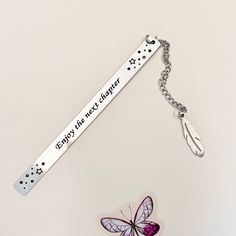 a key chain that has a butterfly on it