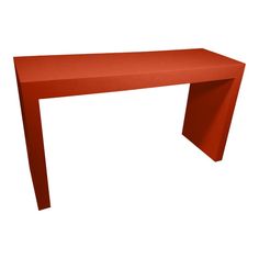 a long red table sitting on top of a white floor