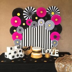 a black and white table topped with lots of decorations