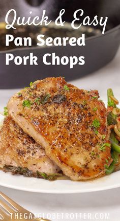 the perfect pan seared pork chops on a white plate with asparagus