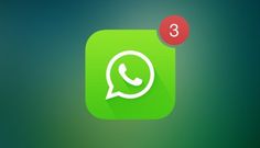 an image of whatsapp on the phone with another app icon in the background