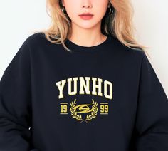 Dive into the world of Ateez with this exclusive Yunho Sweatshirt. These stylish and comfortable sweatshirts pay homage to the incredible talent and charisma of each Ateez member. Choose your bias or collect them all to showcase your love for this sensational K-Pop group. Crafted from premium, cozy fabric, these sweatshirts are more than just clothing; they're wearable tributes to the distinctive personalities that make up the powerhouse that is Ateez. Whether you're a seasoned ATINY or a new fan discovering the group's magic, these sweatshirts let you wear your Ateez pride with style. From Hongjoong to Seonghwa, Yunho, Yeosang, San, Mingi, Wooyoung, and Jongho, each sweatshirt features the name of a beloved member, allowing you to represent your bias or create a fan wardrobe that's as div Kpop Long Sleeve Sweatshirt For Winter, Kpop Long Sleeve Sweatshirt With Letter Print, Kpop Style Long Sleeve Sweatshirt With Letter Print, Black Kpop Sweatshirt With Graphic Print, Black Kpop Graphic Print Sweatshirt, Black Kpop Style Graphic Print Sweatshirt, Hip Hop Long Sleeve Sweatshirt For Fans, Hip Hop Style Long Sleeve Sweatshirt For Fans, Kpop Style Sweatshirt For Fall Streetwear