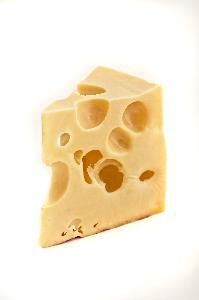 a piece of cheese with holes in it