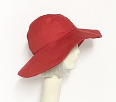 Wide Brim sun hat made with red cotton twill , lined in rayon print, the hat has a 2 section crown 3 1/2 " in length and a one piece 4" brim, a cotton band inside. One size fits most up to 23" Machine wash cold / hand dry Made in USA Press if needed / packable Beret Hat Bow, Packable Hat, Travel Hat, Wide Brim Sun Hat, Red Sun, Wool Berets, Black Chevron, Chevron Stripe, Beret Hat