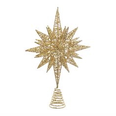 a gold christmas tree topper on a white background