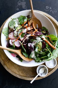 a salad with carrots, radishes and dressing