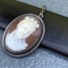 We take pride in finding unique , quality ~ Antique /Vintage jewelry pieces which are carefully hand picked by us so that you can add them to your treasure/ collection or gift to someone you love ~ We try to add plenty of items every week and have been selling online for more then 10 years . Antique Victorian ~ sterling silver ~ deeply hand carved cameo ~ pendant ~ Just add chain and its ready to wear . Marked 800 for silver Dates late 19th to early 20th century Materials : 800 silver shell came Vintage Silver Carved Jewelry, Vintage Carved Silver Jewelry, Vintage Carved Jewelry For Anniversary, Carved Vintage Jewelry For Anniversary, Antique Silver Cameo Jewelry, Vintage Silver Carved Necklaces, Silver Vintage Carved Necklaces, Vintage Stamped 925 Silver Pendant Jewelry, Antique Cameo Jewelry In Antique Silver