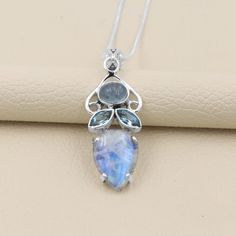 Rainbow Moonstone Pendant Necklace, Blue Topaz Pendant Necklace, Aquamarine Necklace, Moonstone Blue Topaz Solid Silver Handmade Pendant, Elegant unique Multi-gemstone Rainbow Moonstone and blue topaz meditation Pendant. Rainbow Moonstone is a stone for a new beginning. Moonstone is a stone of inner growth and strength. Moonstone enhances intuition promotes inspiration and success and very good fortune in love and business matters. Rainbow moonstone is a birthstone of JUNE month The pendant leng June Month, Moonstone Necklace Silver, Blue Topaz Pendant Necklace, Moonstone Pendant Necklace, Inner Growth, Handmade Pendant Necklace, Rainbow Moonstone Pendant, Blue Topaz Pendant, Aquamarine Necklace