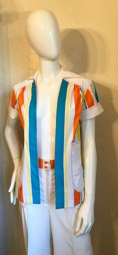 "Wow....1970's Mod pants suit - tagged Strawberry Plant California by Dorothy Schoelen. Here is a great set In a cotton blend broadcloth fabric. The jacket has the bright stripes in an open style with short cuffed Sleeves, patch pockets and has the contrasting top stitching. The pants are a high waist wide leg style and have the stripe waistband and orange contrasting top stitching with a front nylon zipper. Both in great condition. Tagged a size 7/8. measurements lying flat: Jacket - Bust 19\", Fitted Multicolor Sets With Pockets, Retro Fitted Cotton Sets, Retro Cotton Sets With Short Sleeves, Multicolor Fitted Sets With Pockets, Retro Cotton Short Sleeve Sets, Retro Print Beach Top With Camp Collar, White Vintage Cotton Sets, Retro Cotton Bottoms With Vertical Stripes, Retro Yellow Pants With Pockets