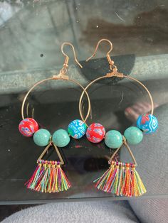 These handmade, homemade beach beauties are perfect for your next tropical vacation. The colorful tassels and beads evoke a sense of relaxation and fun. Hurry and pick these lightweight babies up! Handmade Green Tassel Earrings For Festival, Handmade Green Bohemian Tassel Earrings, Bohemian Turquoise Tassel Earrings With Colorful Beads, Bohemian Green Tassel Earrings For Festivals, Bohemian Green Tassel Earrings For Beach, Festival Turquoise Tassel Earrings With Colorful Beads, Turquoise Tassel Earrings With Colorful Beads For Festival, Beaded Tassel Earrings For Beach, Handmade Turquoise Tassel Earrings For Festival