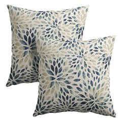 two blue and white pillows on a white background