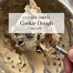 a hand holding a scoop of cookie dough in a metal bowl with the words cottage cheese cookie dough recipe