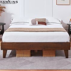 a bed sitting on top of a wooden platform