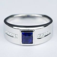 This European style princess cut blue sapphire diamond engagement ring features a 10 princess stone channel set pave in a wide band. Blue Sapphire Rings For Men, Mens Sapphire Ring, Custom Gemstone Rings, Diamond Sapphire Engagement Ring, Sapphire Diamond Engagement, Wedding Plan, Bezel Set Ring, Blue Sapphire Ring, Men's Wedding Ring