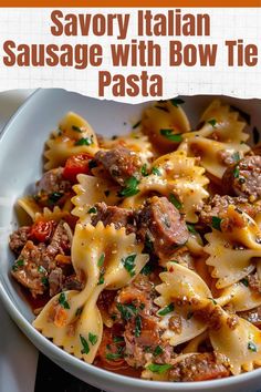 a bowl filled with pasta and meat on top of a table