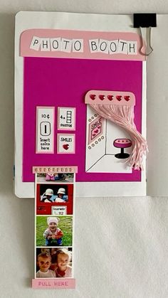 a pink photo booth with pictures on the front and back side, hanging from a hook