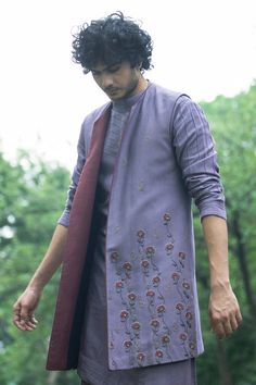 English purple front-open jacket with floral embroidered motifs. Paired with angrakha style collar, pintuck kurta and cotton silk trouser.
Component: 3
Embroidered
Neckline: Open
Sleeve Length: Three quarter
Fabric: Slub Silk, Cotton Silk
Color: Purple
Tonal embroidery - Aza Fashions Jatin Malik, Angrakha Style, Tonal Embroidery, Kurta Set For Men, Embroidered Motifs, Open Jacket, Open Sleeve, Silk Trousers, Embroidered Neckline