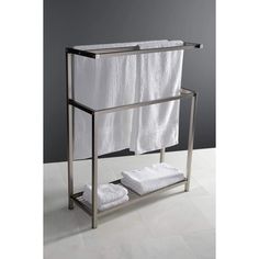 a towel rack with two white towels on it