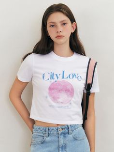 This product is a City Love crop short sleeve T-shirt designed for a stylish and trendy look. The T-shirt features a bold graphic with the text City Love and a cityscape on the front, adding a unique touch. It is made from soft, breathable fabric for all-day comfort. This crop short sleeve T-shirt is perfect for casual wear and summer outings.- This crop short sleeve T-shirt features a bold graphic with the text City Love and a cityscape on the front, adding a unique touch.- It is made from soft, breathable fabric for all-day comfort.- The T-shirt is designed for a stylish and trendy look, perfect for casual wear.- It pairs well with high-waisted jeans or skirts, making it a versatile addition to any summer wardrobe. City Love, Summer Wardrobe, High Waist Jeans, Cityscape, Breathable Fabric, Casual Wear, Tshirt Designs, High Waisted, Top Outfits