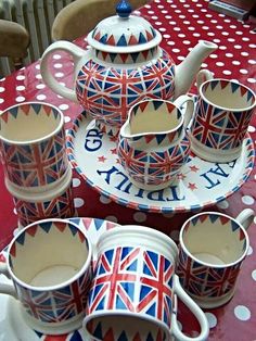 a british themed tea set sitting on top of a table