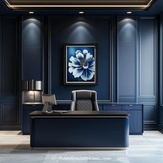 an elegant office with blue walls and black leather chairs, framed artwork on the wall