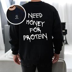 Cozy up in style with this "Need Money for Protein" sweatshirt. Perfect for gym lovers, fitness enthusiasts, and bodybuilders who want a comfortable yet bold pullover. Great for layering during workouts or wearing casually to showcase your sense of humor. - - RETURNS - - (please read) 🔻 All sales are final! Since all items are custom printed for you - returns and exchanges are NOT accepted. Please reach out if you have any issues with your order. --FIT-- SIZE UP for an OVERSIZED FIT. If you are Dumbell Pullover, Funny Text Crew Neck Gym Top, Gym Hoodie With Logo Print, Graphic Print Long Sleeve Gym Hoodie, Sweat-resistant Gym Hoodie, Bodybuilder, Need Money, Gym Humor, Gym Rat